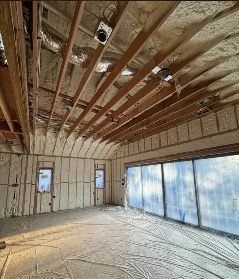 Interior walls and ceiling insulated with spray foam during new construction in Hornell